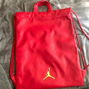 Red with a gold pendent and black on the inside